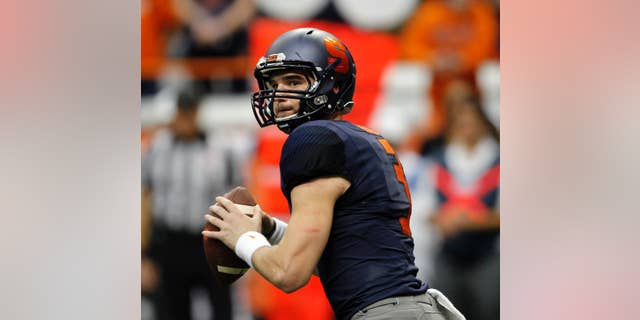 Syracuse’s Mitch Kimble looks to pass during the third quarter of an NCAA college football game against Duke in Syracuse, N.Y., Saturday, Nov. 8, 2014. Duke won 27-10. (AP Photo/Nick Lisi)
