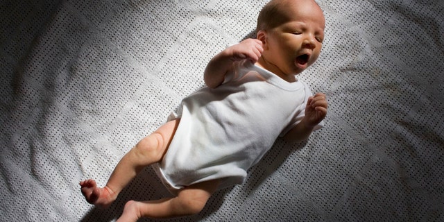 KNUTSFORD, UNITED KINGDOM - (FILE) In this file photograph taken in March 12, 2007, a two-week-old boy eyes his new world. Health Secretary Patricia Hewitt announnced, April 3, 2007 that for the first time, mothers-to-be will have a guarantee that the NHS will provide them with a full range of birthing choices - including home births - and a midwife they know and trust to care for them. (Photo by Christopher Furlong/Getty Images)
