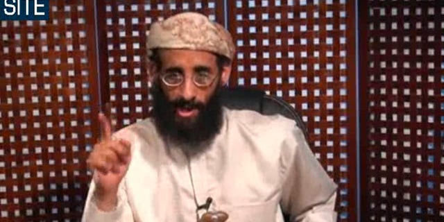 FILE - In this Monday, Nov. 8, 2010 file photo taken from video and released by SITE Intelligence Group, Anwar al-Awlaki speaks in a video message posted on radical websites. American drone strikes in southern Yemen have killed nine al-Qaida-linked militants, including the media chief for the group's Yemeni branch and the son of al-Awlaki, a prominent U.S.-born cleric slain in a similar attack last month, government officials and tribal elders said Saturday. (AP Photo/SITE Intelligence Group, Dile) NO SALES, MANDATORY CREDIT
