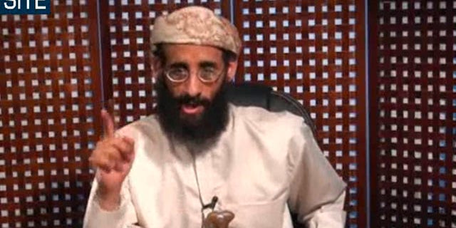 FILE - In this Monday, Nov. 8, 2010 file photo taken from video and released by SITE Intelligence Group, Anwar al-Awlaki speaks in a video message posted on radical websites. American drone strikes in southern Yemen have killed nine al-Qaida-linked militants, including the media chief for the group's Yemeni branch and the son of al-Awlaki, a prominent U.S.-born cleric slain in a similar attack last month, government officials and tribal elders said Saturday. (AP Photo/SITE Intelligence Group, Dile) NO SALES, MANDATORY CREDIT