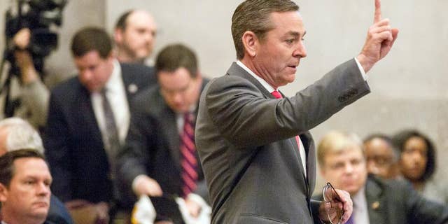 House Republican Caucus Chairman Glen Casada signals to colleagues on the House floor in Nashville, Tenn., Wednesday April 6, 2016, during a debate about a bill to allow counselors to refuse treatment of patients based on personal beliefs. Those opposed to the bill, say the measure casts such a wide net that therapists could virtually turn anyone away. (AP Photo/Erik Schelzig)