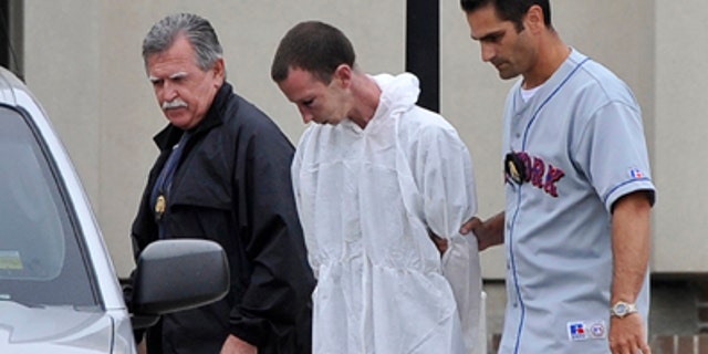June 22: David Laffer, a suspect in the shooting deaths of four people at a pharmacy during a botched weekend painkiller robbery, is escorted out of Suffolk County Police Headquarters in Yaphank, N.Y.
