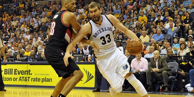 MEMPHIS, TN - APRIL 19: Marc Gasol #33 of the Memphis Grizzlies drives past Nicolas Batum #88 of the Portland Trailblazers in the second quarter of Game One of the first round of the 2015 NBA Playoffs at FedExForum on April 19, 2015 in Memphis, Tennessee. NOTE TO USER: User expressly acknowledges and agrees that, by downloading and/or using this photograph, user is consenting to the terms and conditions of the Getty Images License Agreement. (Photo by Frederick Breedon/Getty Images)