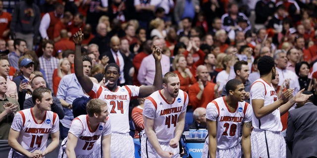 Louisville players react on the bench react in the final minutes of the second half of the Midwest Regional final against Duke in the NCAA college basketball tournament, Sunday, March 31, 2013, in Indianapolis. Louisville won 85-63 to advance to the Final Four. (AP Photo/Darron Cummings)
