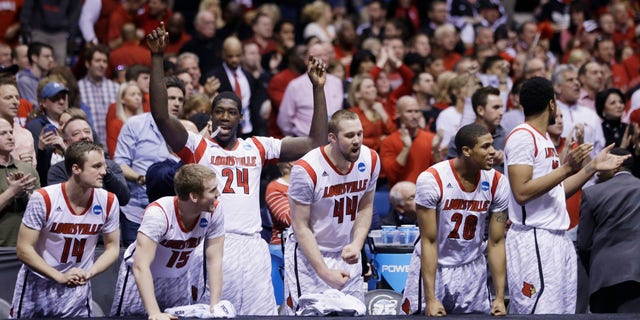 Louisville players react on the bench react in the final minutes of the second half of the Midwest Regional final against Duke in the NCAA college basketball tournament, Sunday, March 31, 2013, in Indianapolis. Louisville won 85-63 to advance to the Final Four. (AP Photo/Darron Cummings)