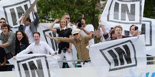 Irish singer Bob Geldof, center, gestures on board a boat taking part in a pro-EU counter demonstration, as a Fishing for Leave pro-Brexit "flotilla" makes its way along the River Thames in London, Wednesday, June 15, 2016. (Stefan Rousseau/PA via AP) UNITED KINGDOM OUT