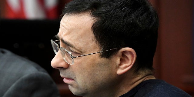 A tear falls from Larry Nassar's eye Friday, Jan. 19, 2018, as he is confronted in Circuit Judge Rosemarie Aquilina's courtroom during the fourth day of victim impact statements regarding former sports medicine doctor Larry Nassar, who pled guilty to seven counts of sexual assault in Ingham County, and three in Eaton County.