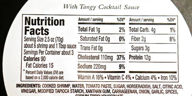 This Monday, Nov. 16, 2015 photo shows the back label of a Publix brand shrimp cocktail platter, a product of Thailand, purchased in Orlando, Fla. In November 2015, AP journalists followed and filmed trucks loaded with freshly peeled shrimp going from the Gig Peeling Factory in Samut Sakhon, Thailand to major Thai exporting companies, and then tracked it globally. They also traced similar connections from another factory raided six months earlier and interviewed more than two dozen workers from both sites. The shrimp made its way into the supply chains of major food stores and retailers in all 50 U.S. states. (AP Photo/John Raoux)