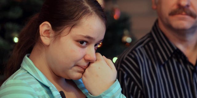Dec. 22, 2012: Kristina Shevchenko, Clackamas Town Center shooting victim, talks to reporters for first time at her house as her father Veniamin looks on.