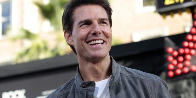 Cast member Tom Cruise poses at the premiere of "Rock of Ages" at the Grauman's Chinese theatre in Hollywood, California June 8, 2012. The movie opens in the U.S. on June 15. REUTERS/Mario Anzuoni (UNITED STATES - Tags: ENTERTAINMENT)