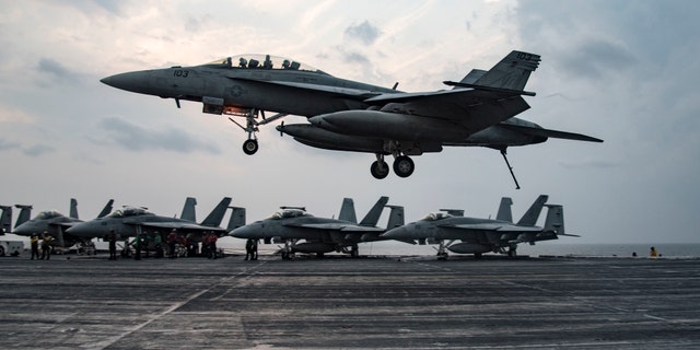 File photo - An F/A-18 F Super Hornet assigned to the Fighting Swordsmen of Strike Fighter Squadron (VFA) 32 prepares to make an arrested landing on the flight deck of the aircraft carrier USS Dwight D. Eisenhower (CVN 69) (Ike) in the Arabian Gulf.