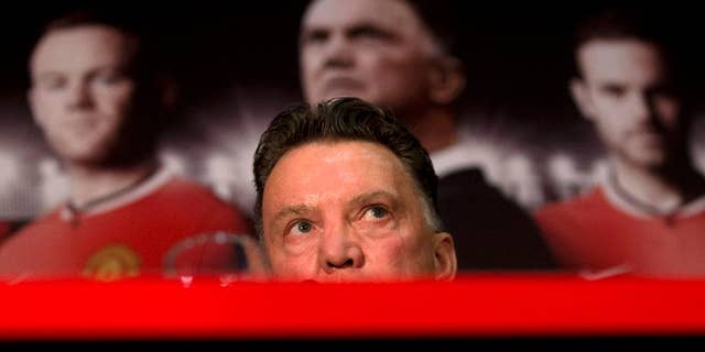 Manchester United's new manager Louis van Gaal speaks during a press conference at Old Trafford Stadium, Manchester, England, Thursday July 17, 2014. The new manager takes over after recently guiding Holland to third place at the 2014 World Cup. (AP Photo/Jon Super)
