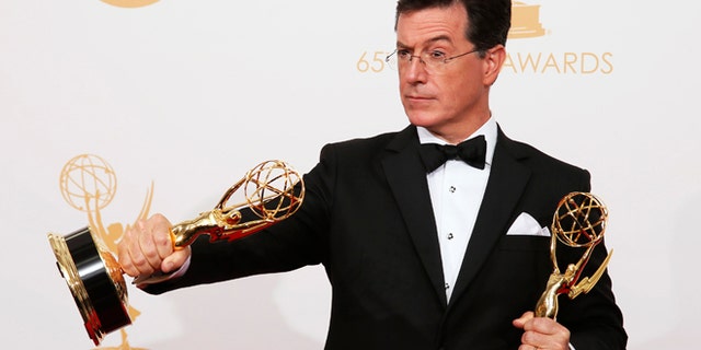 The cast from AMC's series "Breaking Bad" poses backstage with their awards for Outstanding Drama Series
at the 65th Primetime Emmy Awards in Los Angeles September 22, 2013.