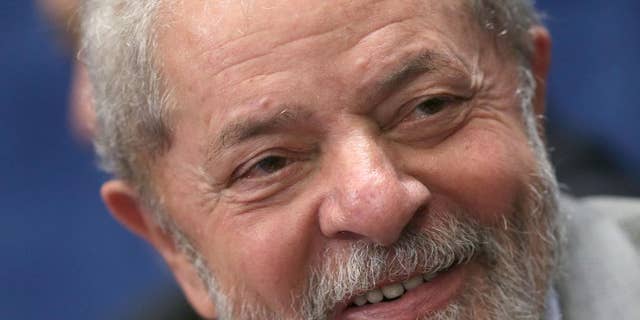 FILE - In this Aug. 29, 2016 file photo, Brazil's former President Luiz Inacio Lula da Silva attends the impeachment trial of suspended President Dilma Rousseff in Brasilia, Brazil. Federal investigators charged Lula with money laundering and corruption on Wednesday, Sept. 14, 2016 in connection with a sprawling corruption investigation at state-run oil giant Petrobras. (AP Photo/Eraldo Peres, File)