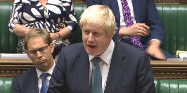 Britain's Foreign Secretary Boris Johnson speaks  in the House of Commons, London in this image taken from TV Tuesday Oct. 11, 2016. Johnson said  “all the available evidence" points to Russian responsibility for the bombing of an aid convoy in Syria. Johnson told the House of Commons that Russia is “in danger of becoming a pariah nation” because of its actions in Syria. (PA via AP)