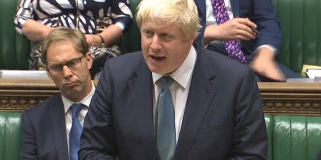 Britain's Foreign Secretary Boris Johnson speaks in the House of Commons, London in this image taken from TV Tuesday Oct. 11, 2016. Johnson said “all the available evidence" points to Russian responsibility for the bombing of an aid convoy in Syria. Johnson told the House of Commons that Russia is “in danger of becoming a pariah nation” because of its actions in Syria. (PA via AP)