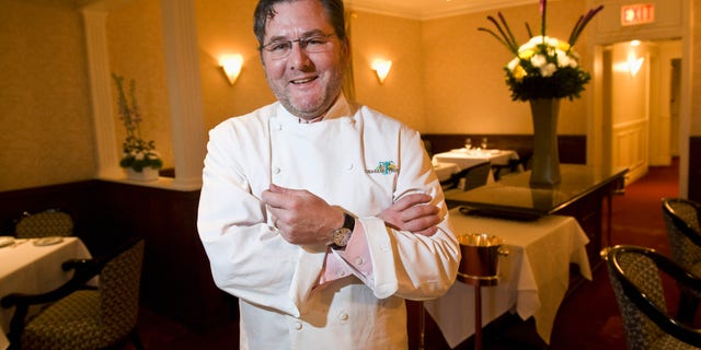 In this Dec. 30, 2011 photo, renowned chef Charlie Trotter poses for a photo in the dining room of his restaurant in Chicago. Trotter died Tuesday, Nov. 5, 2013, a year after closing his namesake Chicago restaurant that was credited with putting his city at the vanguard of the food world and training dozens of the nation's top chefs. He was 54. (AP Photo/Sun-Times Media, Rich Hein) MANDATORY CREDIT, MAG OUT