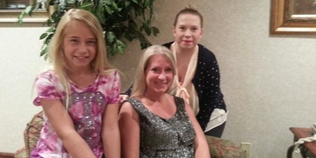 July 1, 2013: This photo provided by the family shows, from left, Jolene, Janet and Gabrielle Dunnabeck at their home in Whitney, Texas.