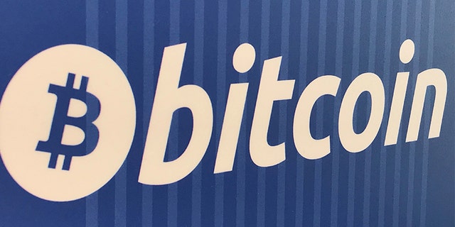 FILE PHOTO: A Bitcoin logo is seen on a cryptocurrency ATM in Santa Monica, California, U.S., January 4, 2018. REUTERS/Lucy Nicholson/File Photo - RC1DBEB89E70