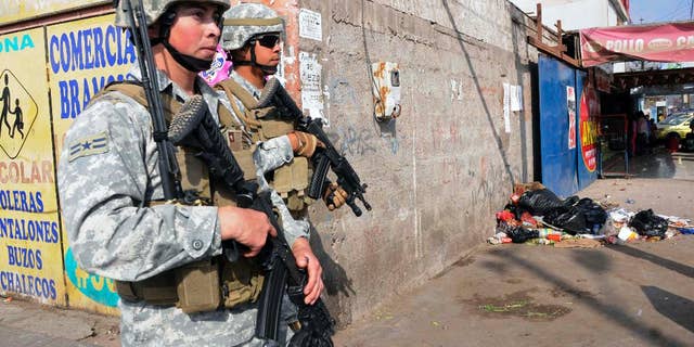 Soldiers patrol after earthquakes affected Alto Hospicio, Chile, Thursday, April 3, 2014. Chile is one of the world's most earthquake-prone countries, and tsunamis are a particular danger because the fault zone lies just offshore, where the Nazca tectonic plate plunges beneath the South American plate. A magnitude-8.2 earthquake hit Chile's Pacific coast late Tuesday. (AP Photo/Cristian Vivero)