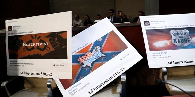 Examples of Facebook pages are seen, as executives appear before the House Intelligence Committee to answer questions related to Russian use of social media to influence U.S. elections, on Capitol Hill in Washington, Nov. 1, 2017.