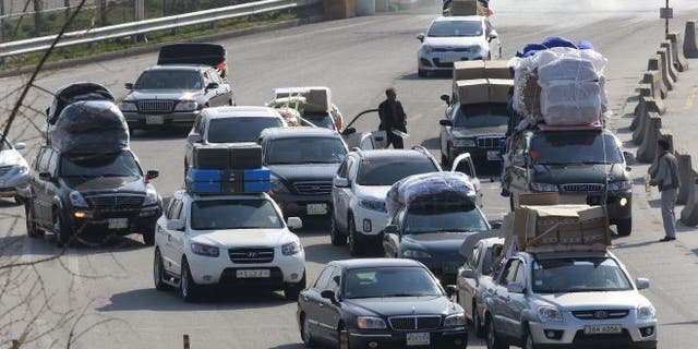 April 27, 2013: South Korean vehicles carrying products from North Korea's Kaesong industrial complex arrive at the customs, immigration and quarantine office near the border village of Panmunjom in Paju, South Korea.