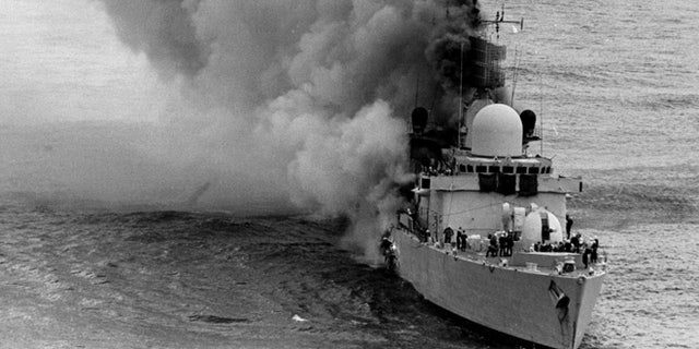 Apr. 20, 1982: British Royal Navy HMS Sheffield frigate, damaged from Argentine Exocet missile, before sinking, during The Falkland Islands war. (AP)