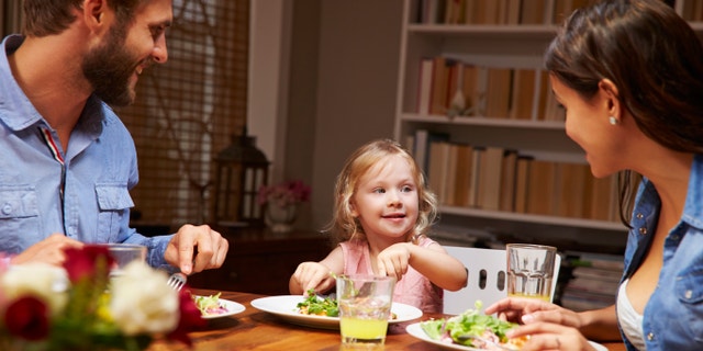 Family eating dinner at a dining table