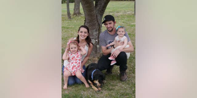 Devon, Trevor, and their two daughters.