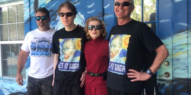 The homeowners (above right) said the colorful mural was intended to serve as a sort of landmark and beacon for their adult autistic son, Chip, in case he got lost and couldn’t find his way home. They hope he can one day live in the home with his caretakers.