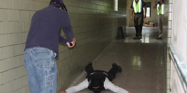 Teachers practice for an active shooter scenario in an Ohio school.