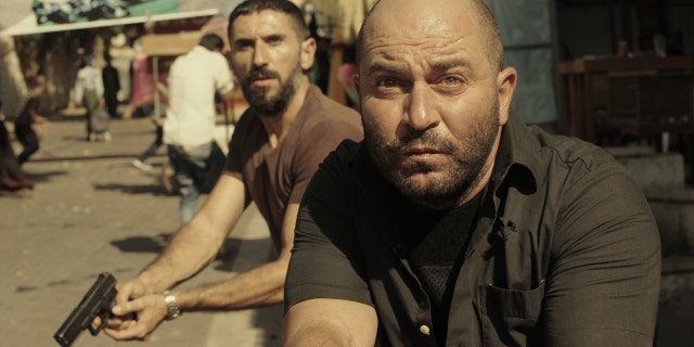 Lior Raz (right) stars as Doron Kavillio in "Fauda."