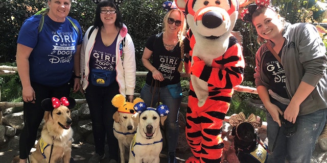 From waiting on crowded lines to watching kids run amok, the lively environment of the park benefits training for the pups on various levels.