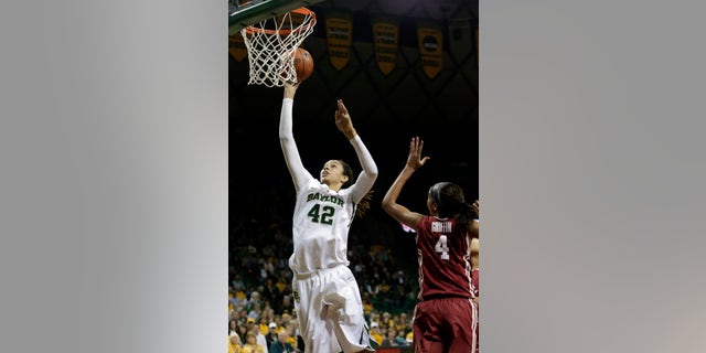 Baylor's Brittney Griner (42) shoots against Oklahoma's Nicole Griffin (4) during the first half of an NCAA college basketball game Saturday, Jan. 26, 2013, in Waco Texas. (AP Photo/LM Otero)