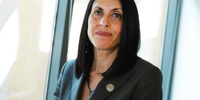 In this Wednesday, March 29, 2017, photo, Adele Kimmel, senior attorney with the law firm Public Justice and head of its anti-bullying campaign, poses for a photograph at their national headquarters in Washington. “The notion of holding schools accountable and making sure they make changes to address sexual assault is very important to victims,” said Kimmel. (AP Photo/Carolyn Kaster)