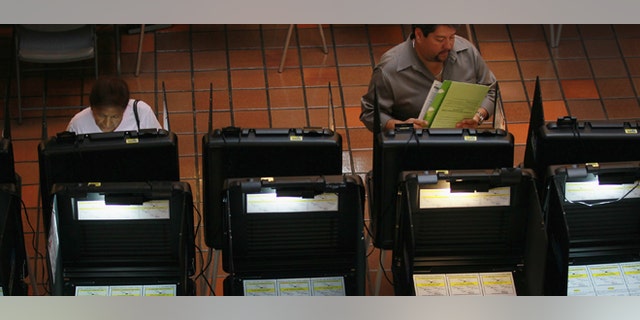 MIAMI, FL - MAY 09: Early voters fill out their ballots as they cast their votes before the general election date scheduled for May 24th, during the special election to select a new Miami-Dade mayor on May 9, 2011 in Miami, Florida. The former mayor Carlos Alvarez was voted out of office by voters unhappy with a property tax rate increase and the fact that he gave salary raises to county employees during a deep recession. The vote to oust the former mayor made Miami-Dade the most populous area ever to recall a local official. 11 candidates are running for the open seat. (Photo by Joe Raedle/Getty Images)