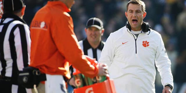 Clemson head coach Dabo Swinney argues a call with an official in the fourth quarter of an NCAA college football game against Georgia Tech, Saturday, Nov. 15, 2014, in Atlanta. Georgia Tech won 28-6. (AP Photo/David Goldman)