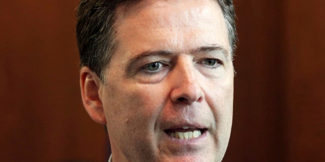 FILE - In this June 17, 2014, file photo, FBI Director James Comey addresses a news conference at the FBI Minneapolis field office in Brooklyn Center, Minn.