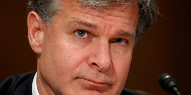 File photo - FBI Director Christopher Wray testifies before a Senate Homeland Security and Governmental Affairs hearing on
