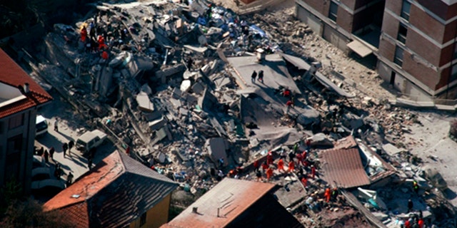 April 6, 2009: An aerial photo provided by the Italian Police shows the debris of a collapsed building in an area near L'Aquila, central Italy, after a powerful earthquake shook central Italy.
