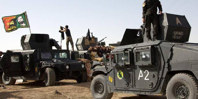 Oct. 14, 2016: Iraqi special forces soldiers deployed for an offensive to retake Mosul from Islamic State militants prepare to move out from a camp near Khazer, Iraq.