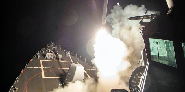 the USS Ross fires a tomahawk missile bound for a Syrian air base.