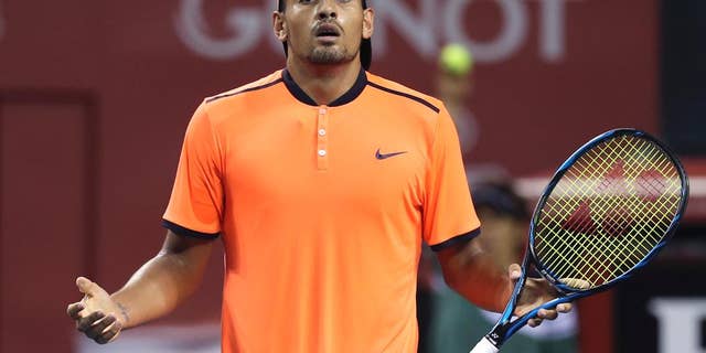 FILE - In this Saturday, Oct. 8, 2016, file photo, Australia's Nick Kyrgios reacts after getting a point against Gael Monfils of France during the semifinal match of Japan Open tennis championships in Tokyo. Kyrgios was booed during a listless 6-3, 6-1 loss to Mischa Zverev at the Shanghai Masters on Wednesday, Oct. 12, 2016, then angrily defended his behavior by saying he didn't owe the spectators anything and fans could "just leave" if they didn't like his attitude. (AP Photo/Koji Sasahara, File)