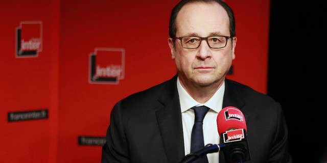French President Francois Hollande prepares to answer a reporter's question during a live interview on French radio station France Inter in Paris Monday, Jan. 5, 2015. (AP Photo/Remy de la Mauviniere/Pool)