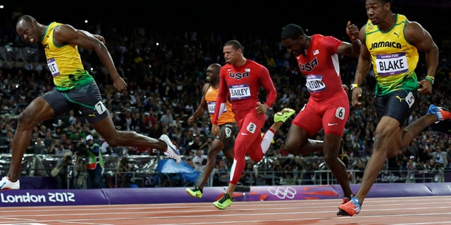 Sunday, Aug. 5: Jamaica's Usain Bolt, left, crosses the finish line ahead of Jamaica's Yohan Blake, right, United States' Justin Gatlin, second from right, United State's Ryan Bailey, third from right, and Netherlands'; Churandy Martina to win gold in the men's 100-meter final during the athletics in the Olympic Stadium at the 2012 Summer Olympics, London.
