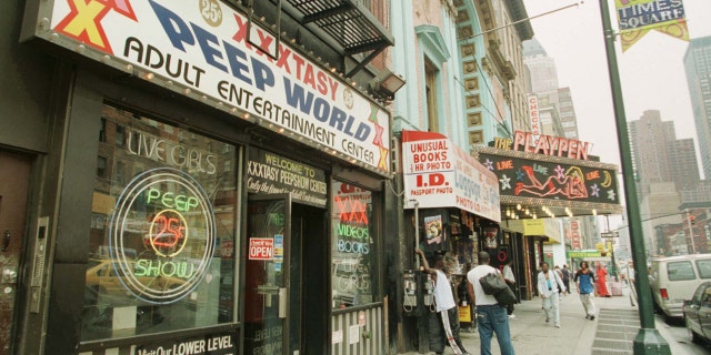 FILE 1998: Strip clubs and pornography shops near Times Square in New York.