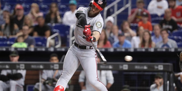 Washington Nationals' Bryce Harper strikes out swinging during the first inning of a baseball game against the Miami Marlins, Saturday, May 26, 2018, in Miami.