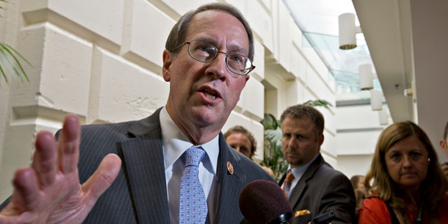 FILE - In this July 10, 2013, file photo House Judiciary Committee Chairman Bob Goodlatte,R-Va., speaks with reporters after House Republicans worked on an approach to immigration reform in a closed-door meeting at the Capitol in Washington. A central question is whether the 11 million immigrants already in the US illegally should get a path to citizenship. "We think a legal status in the United States, but not a special pathway to citizenship, might be appropriate," says Goodlatte. He has said that after attaining legal status, immigrants could potentially use the existing avenues toward naturalization, such as family or employment ties. (AP Photo/J. Scott Applewhite)