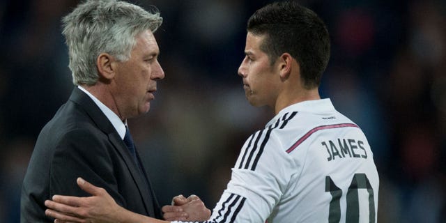 Carlo Ancelotti shakes hands with player James Rodriguez on April 18, 2015 in Madrid, Spain.