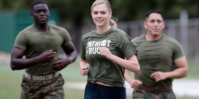 Model and actress Kate Upton takes part in a "workout with the Marines" to raise awareness for Marine Week, Tuesday, Aug. 22, 2017, in Detroit. Upton, fiancé of Detroit Tigers pitcher and Wins for Warriors founder Justin Verlander, and other Tigers Wives participated in a scaled-down workout led by Gunnery Sergeant Sara Pacheco to help support and promote the 2017 Wins for Warriors Patriot Ruck, taking place Saturday, Sept. 9 in Detroit. (AP Photo/Carlos Osorio)